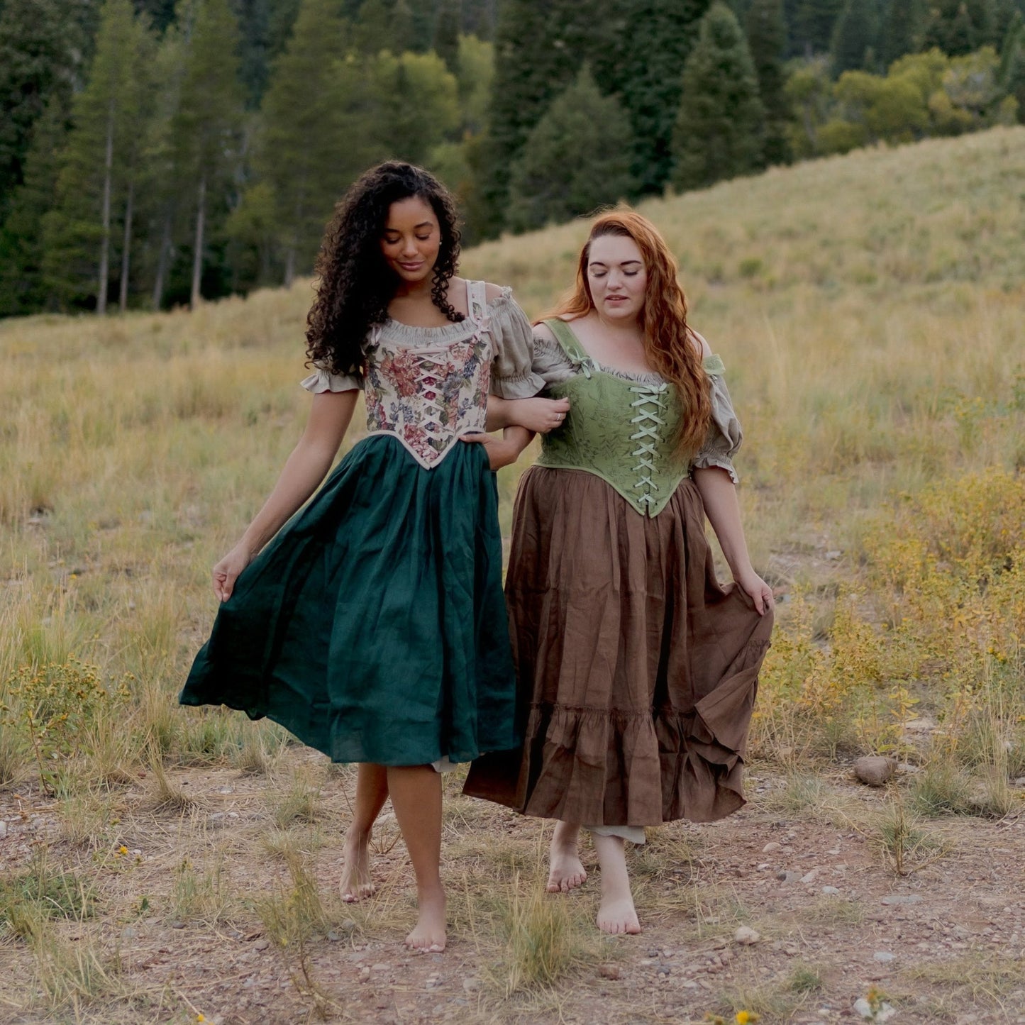 two models wearing cottage core outfits including a linen dress, floral corsets, and linen skirts