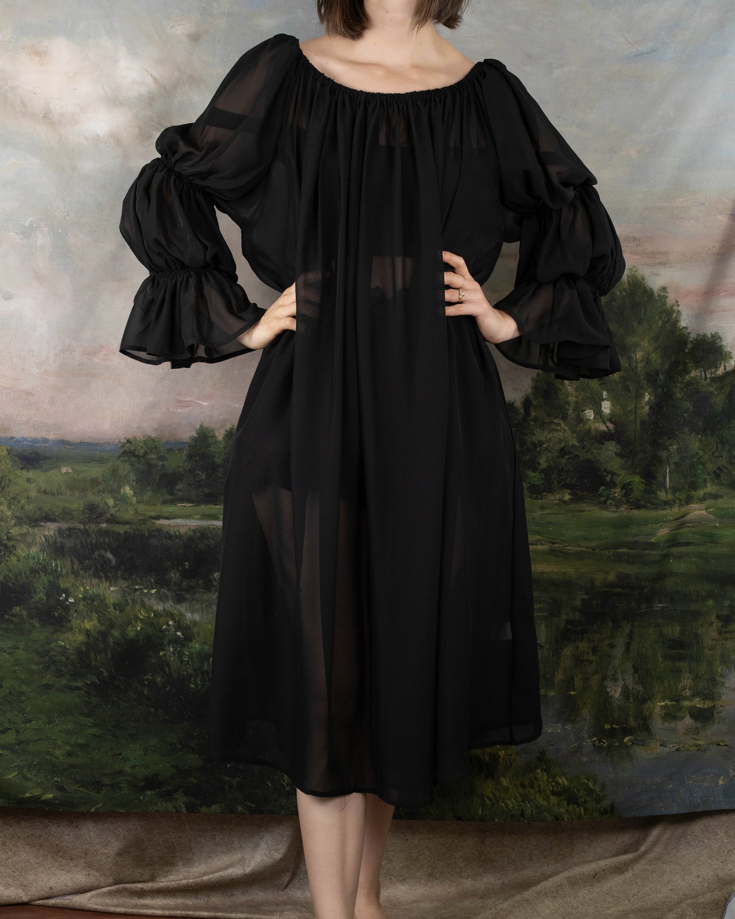 model wearing sheer black witch dress