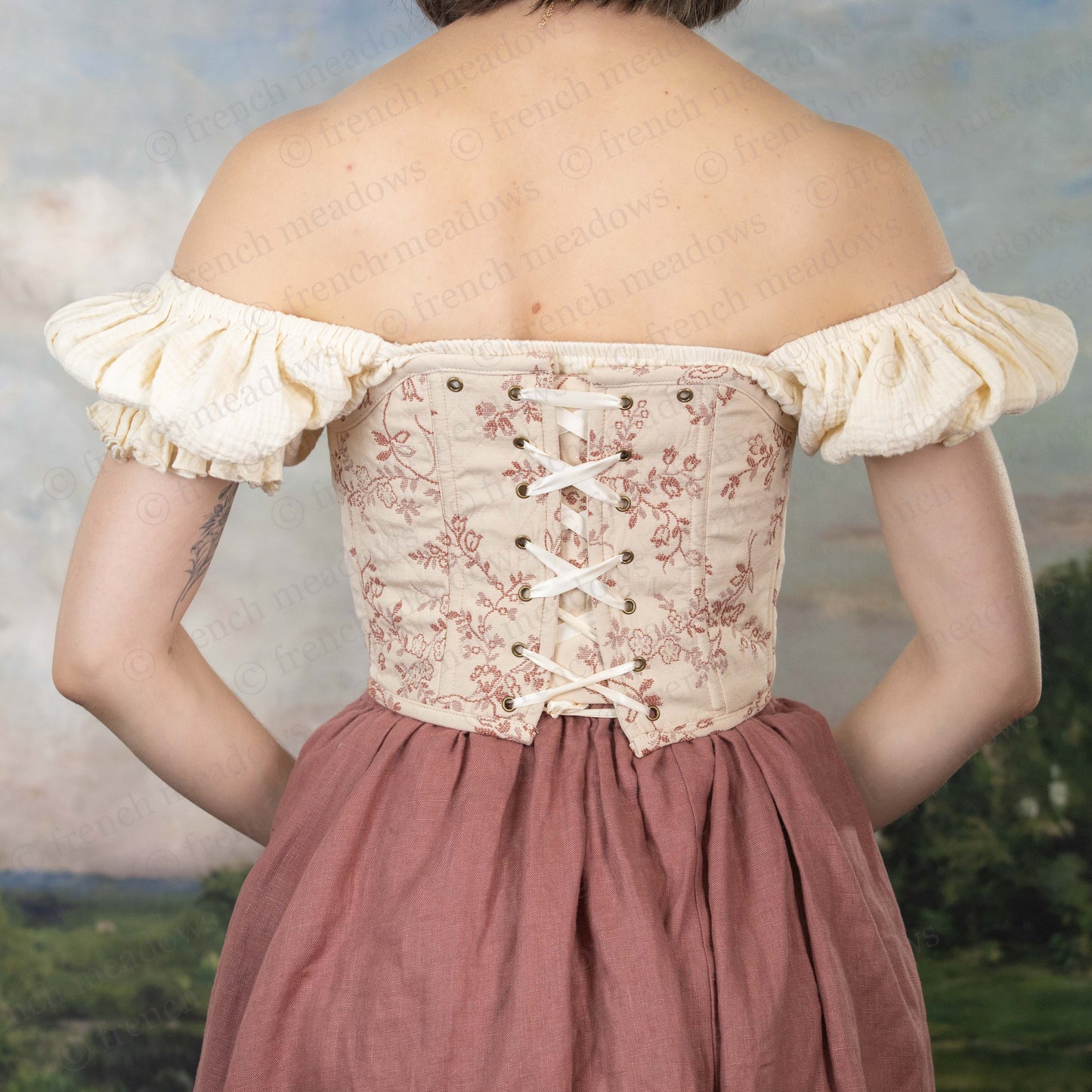 model showing removable straps on rosey floral corset