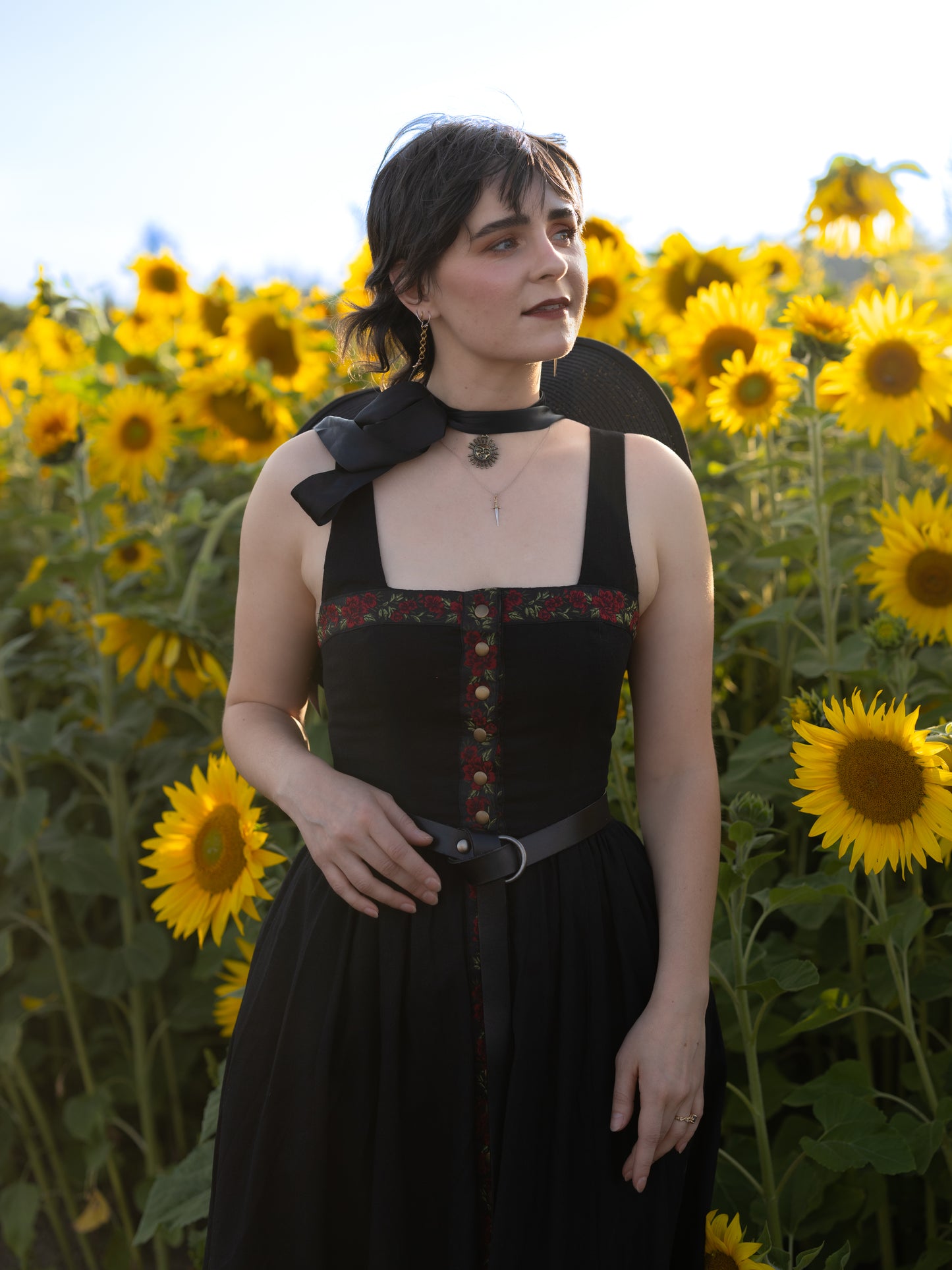 model wearing black ribbon dress styled as a witch